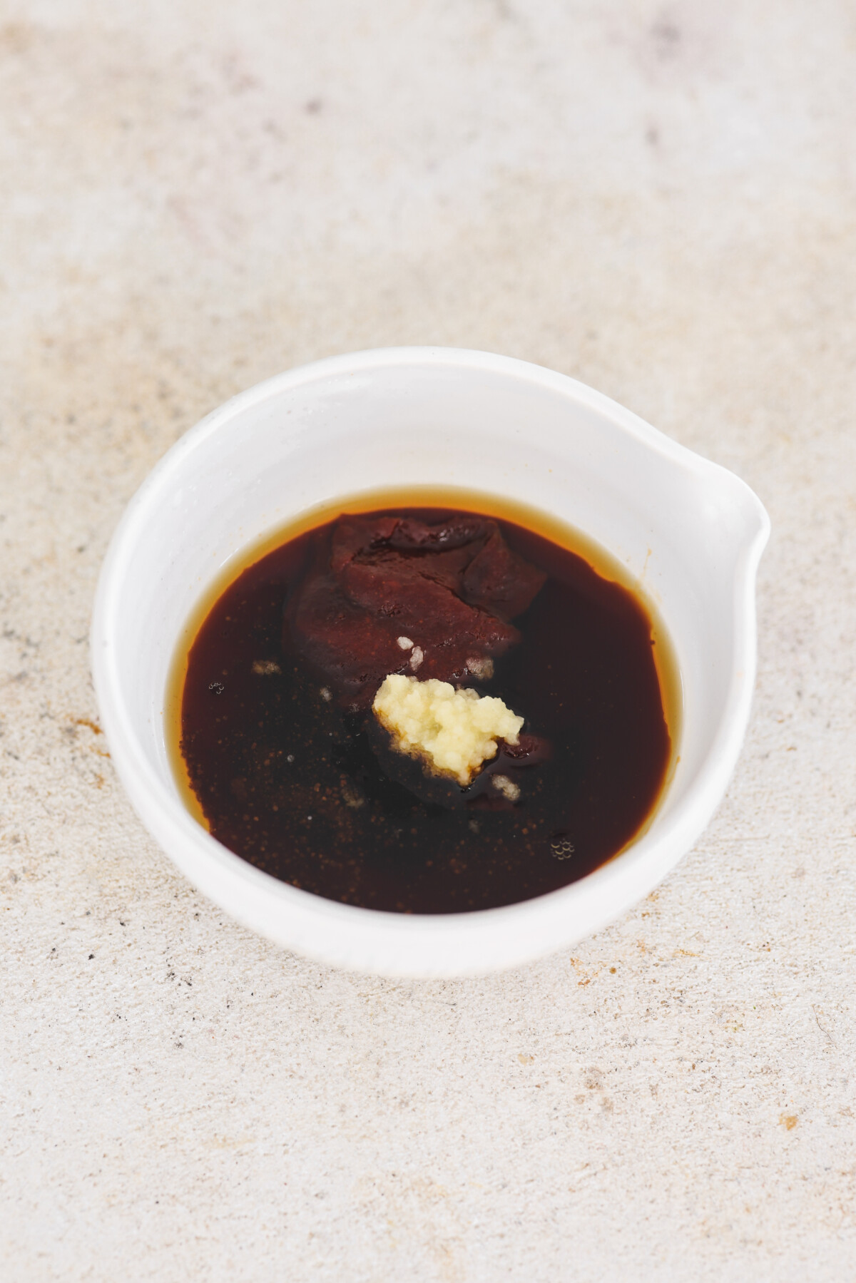 a small bowl of bibimbap sauce mixed together