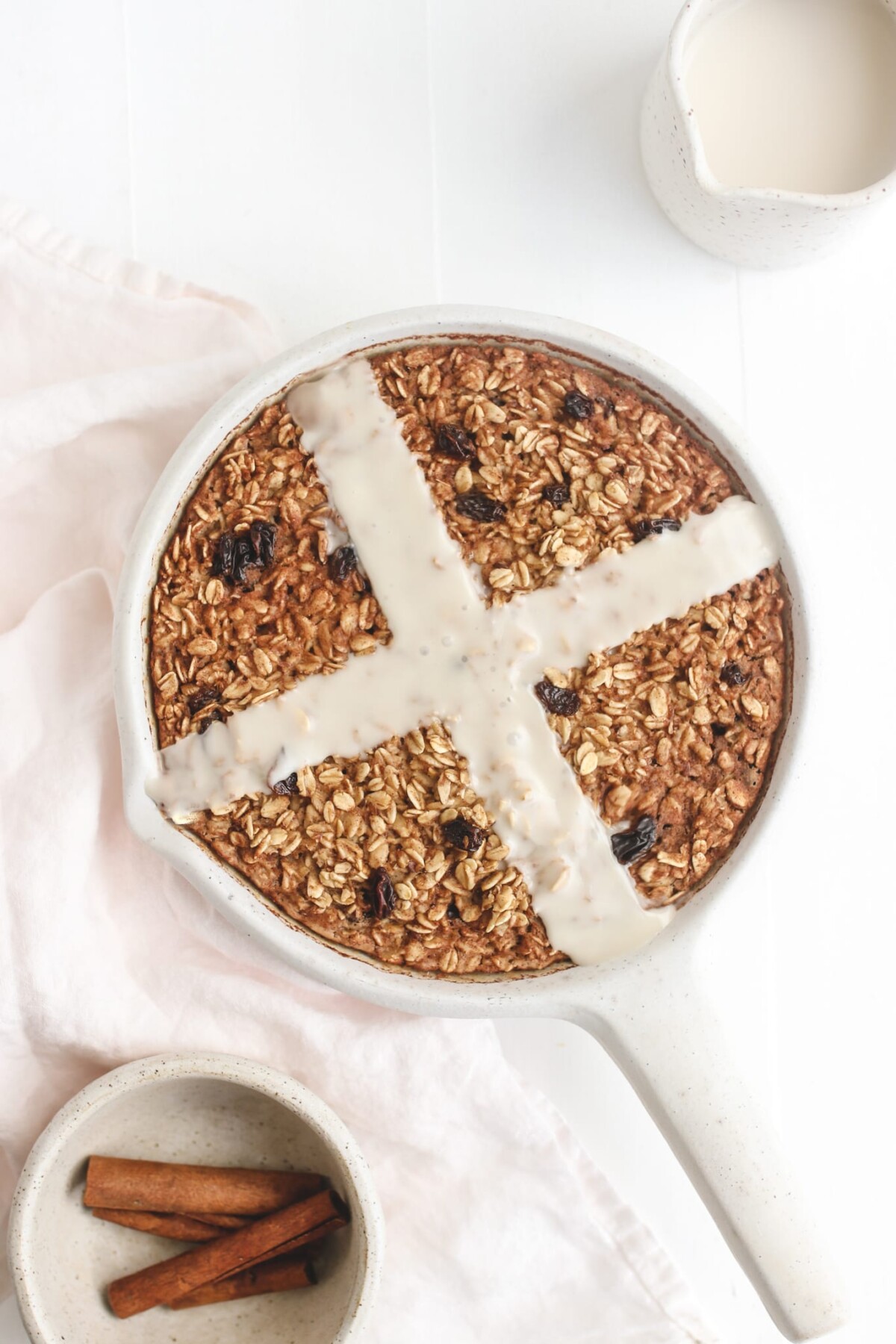 hot cross bun vegan baked oatmeal in a white baking dish