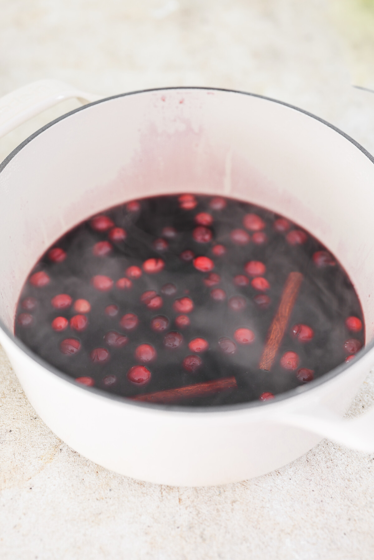 mulled wine simmering in a white pot