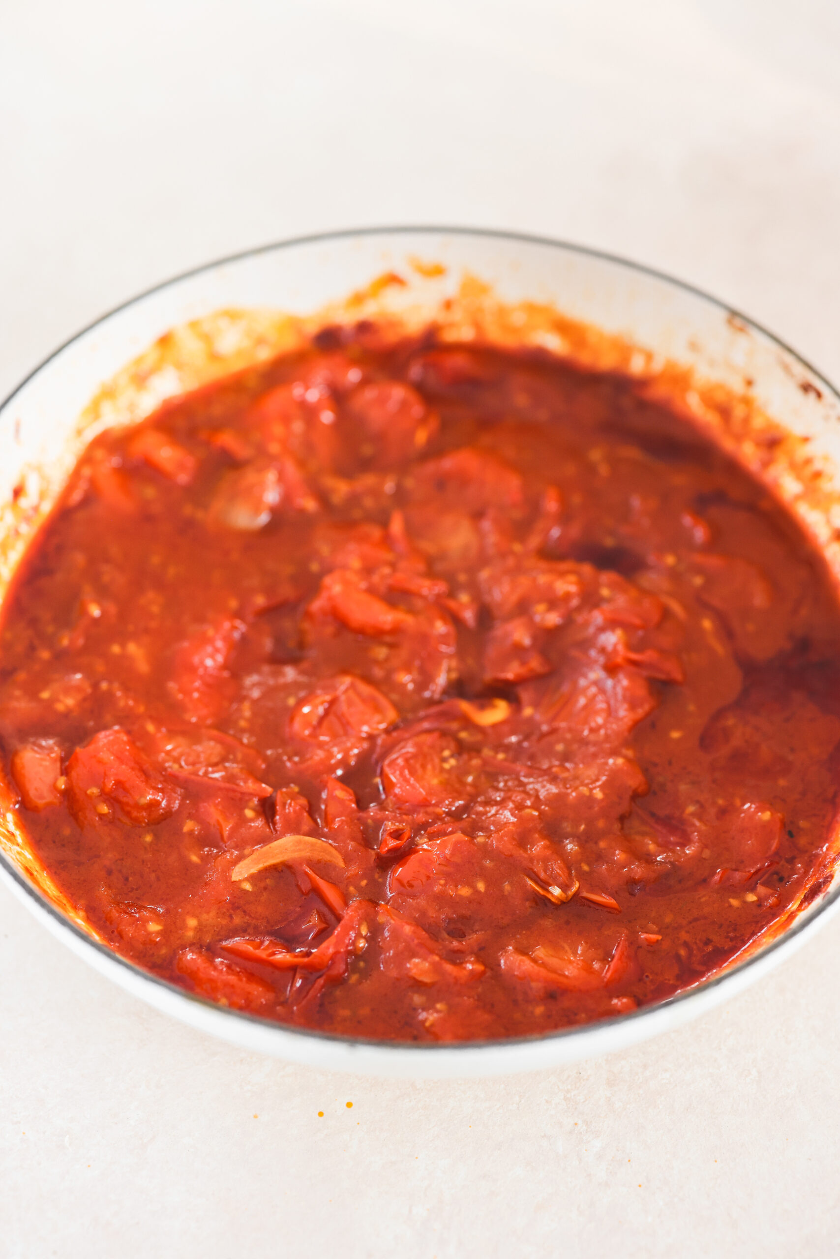 tomato sauce cooking in a skillet