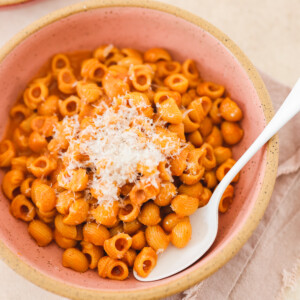 vegan vodka sauce mixed into cooked pasta